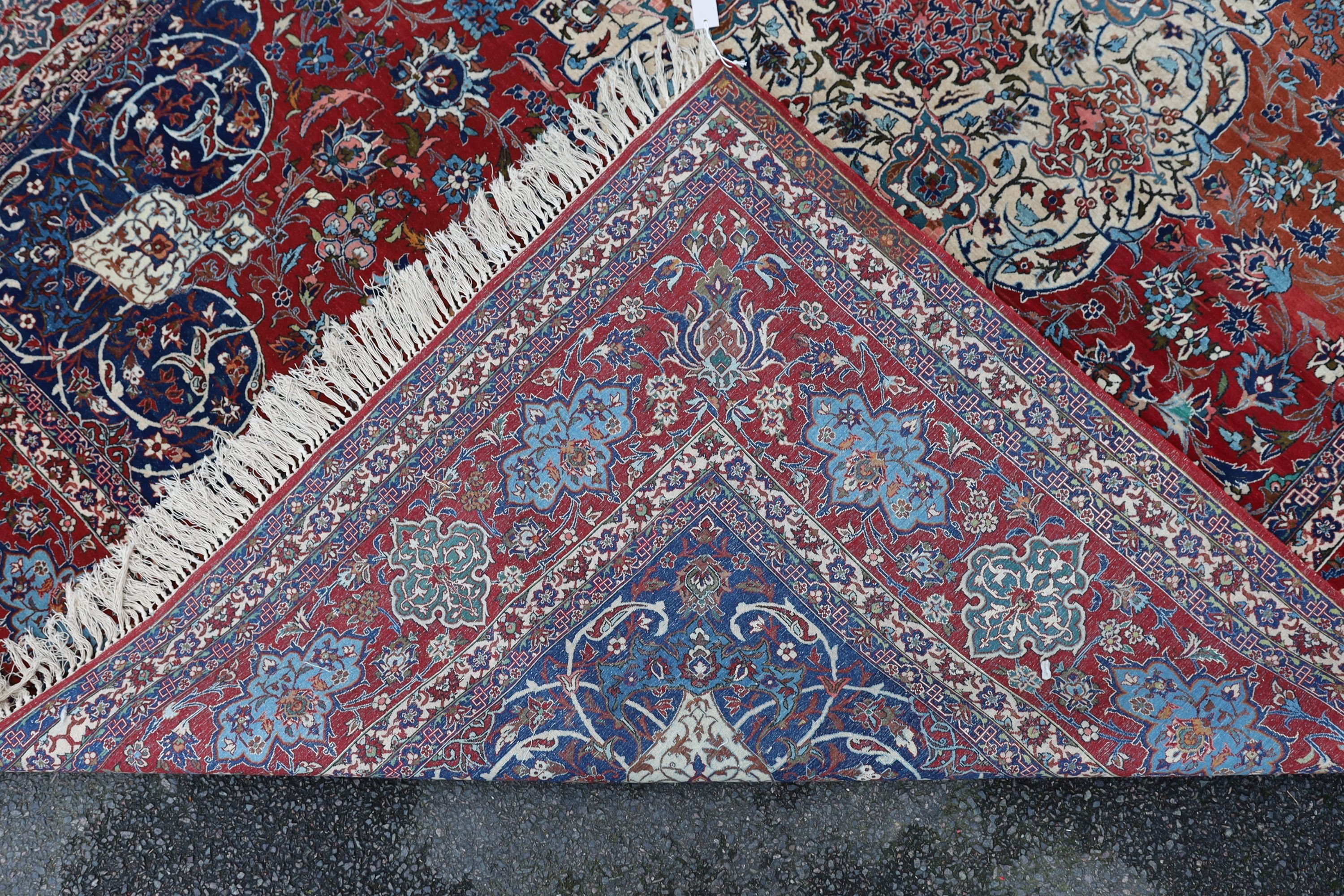 A Isfahan red ground carpet 350 x 260cm.